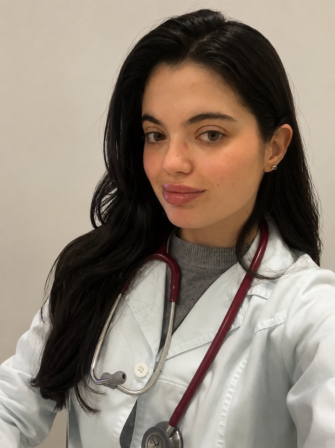 Beatriz Polita wearing a white coat and stethoscope